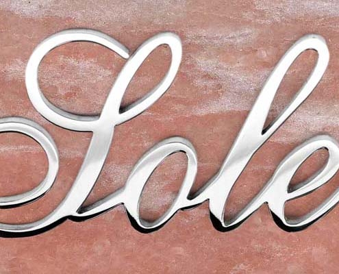 articolo-56-sole-scritta-in-acciaio-inox
